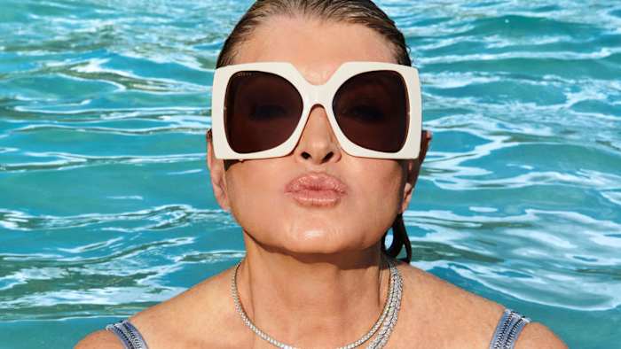 Martha Stewart was photographed by Ruven Afanador in the Dominican Republic. Sunglasses by Gucci provided by Moda Operandi. Necklace by Cicada.